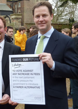 Nick Clegg showing his pledge not to raise student fees