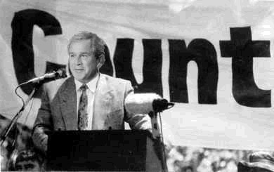 Bush behind a banner that reads c ...unt